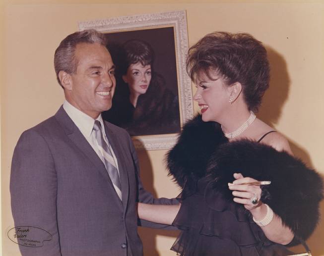 Stan Irwin was not only a producer and actor, but he helped bring The Beatles and, shown here, Judy Garland to Las Vegas.  She played at the Sahara, drawing capacity crowds. The two are shown in front of a portrait of Garland at the Thunderbird Hotel on June 27, 1965.  