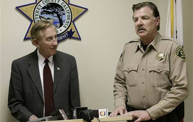 Monterey County, Calif., District attorney Dean Flippo, left, and Monterey County Sheriff Scott Miller answer questions during a news conference, Tuesday, Feb. 25, 2014, in Salinas, Calif. Flippo said the six officers, including the recently retired police chief and the acting chief, have been arrested, in connection to a scheme to steal more than 200 cars from poor Hispanic people.