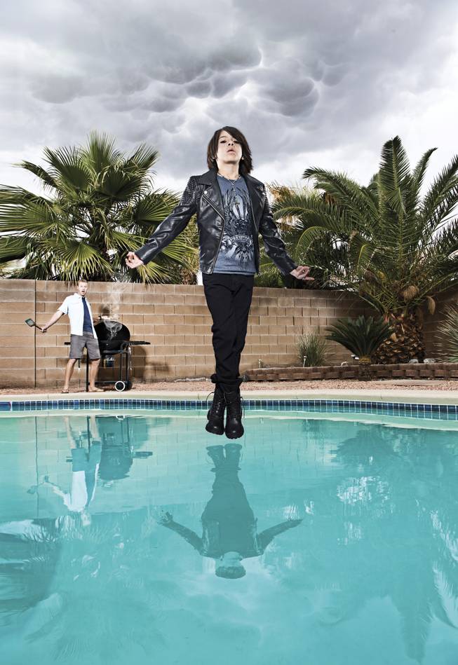 Mindfreak star Criss Angel (photographed by Eric Ita) is well known for levitating above the Luxor, home of his Believe show and CRISS ANGEL MAGICjam. Xavier, 10, takes a cue from the illusionist, floating over the pool as dad Range looks on.