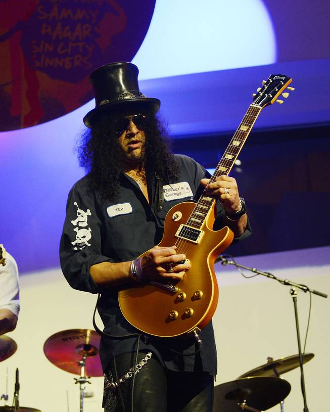 Slash performs during the Kerry Simon "Simon Says Fight MSA" benefit concert at The Keep Memory Alive Center in Las Vegas on Feb. 27, 2014.