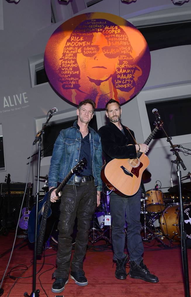 Mark Seliger and Michael Duff perform at "Simon Says Fight MSA" benefit concert at The Keep Memory Alive Center in Las Vegas on Feb. 27, 2014.