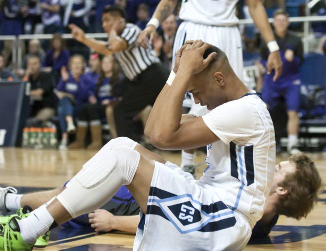 Gerad Davis grips his head in frustration after being called for a charge in the first half Thursday, Feb. 27, 2014 as Canyon Springs defeats Spanish Springs 66-51 in the semifinals of the Nevada State Championships at Lawlor Events Center in Reno.