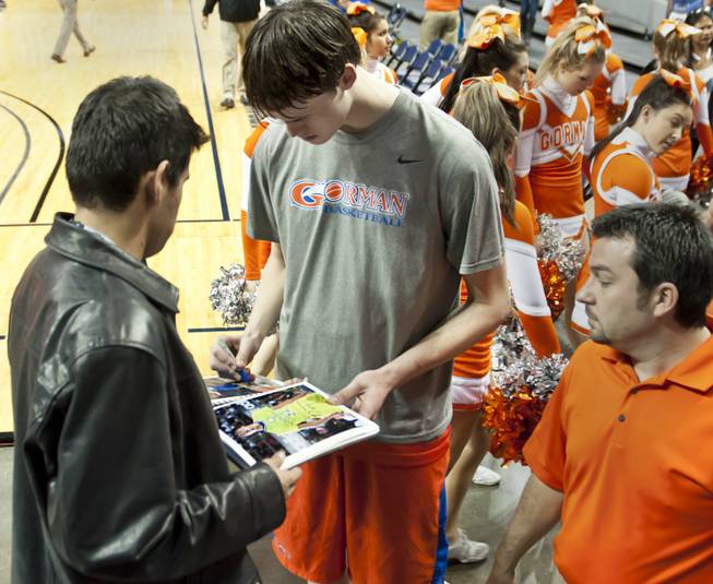 Stephen Zimmerman stops to sign a few autographs before heading to the lockerroom Thursday, Feb. 27, 2014 after Bishop Gorman defeated Reno 68-27 in the semifinals of the Nevada State Championships at Lawlor Events Center in Reno.