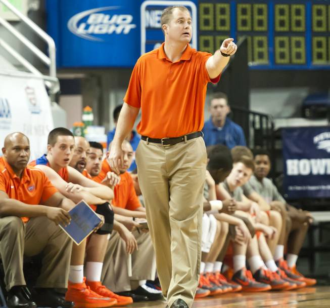 Head coach Grant Rice calls out to his players early in the first half Thursday, Feb. 27, 2014 as Bishop Gorman defeats Reno 68-27 in the semifinals of the Nevada State Championships at Lawlor Events Center in Reno.