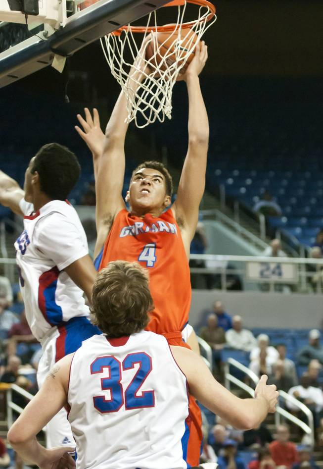 Chase Jeter throws down a two-handed slam after an offensive rebound Thursday, Feb. 27, 2014 as Bishop Gorman defeats Reno 68-27 in the semifinals of the Nevada State Championships at Lawlor Events Center in Reno.
