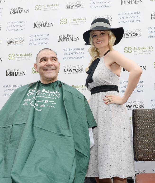Holly Madison after shaving the head of John Katsilometes of The Kats Report in support of St. Baldrick’s Foundation’s fundraiser for childhood cancer research Saturday, March 1, 2014, at New York-New York’s Brooklyn Bridge.

