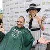 Holly Madison shaves the head of John Katsilometes of The Kats Report in support of St. Baldrick’s Foundation’s fundraiser for childhood cancer research Saturday, March 1, 2014, at New York-New York’s Brooklyn Bridge.

