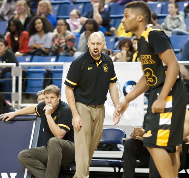 Head coach Chad Beeten calls out to his players from the sideline Saturday, March 1, 2014 as Clark High School defeated Elko High School 43-25 winning the Division I-A state championship at Lawlor Event Center in Reno.