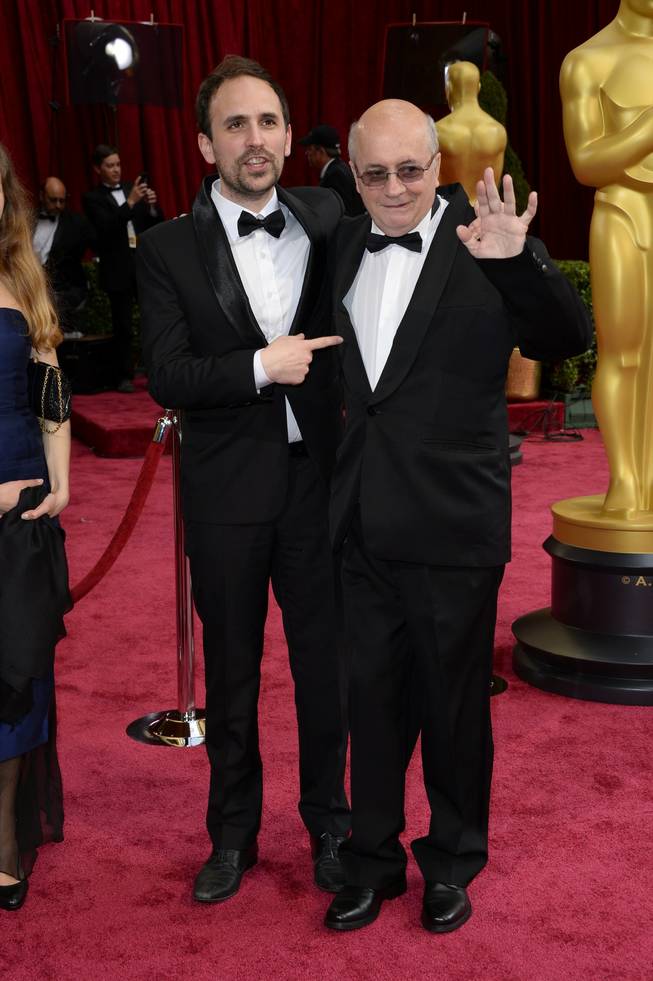 Benjamin Renner, left, and Didier Brunner arrive at the Oscars on Sunday, March 2, 2014, at the Dolby Theatre in Los Angeles.  (Photo by Dan Steinberg/Invision/AP)