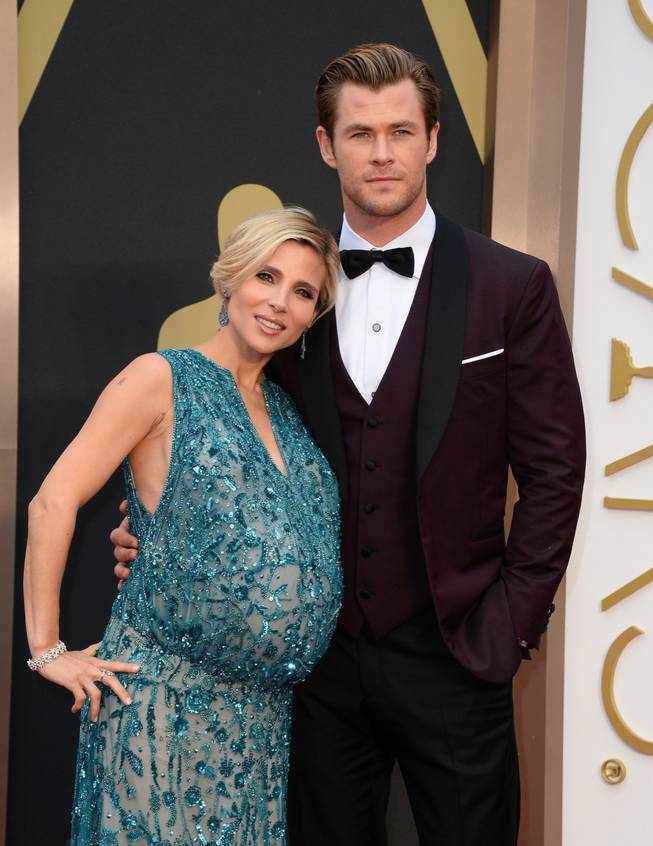 Elsa Pataky, left, and Chris Hemsworth arrive at the Oscars on Sunday, March 2, 2014, at the Dolby Theatre in Los Angeles. 