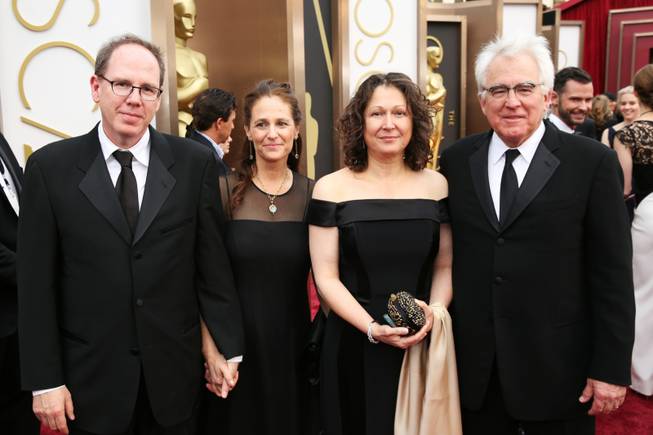 Albert Berger, from left, Ellen Steloff, Annette Yerxa and Ron Yerxa arrive at the Oscars on Sunday, March 2, 2014, at the Dolby Theatre in Los Angeles.  (Photo by Matt Sayles/Invision/AP)