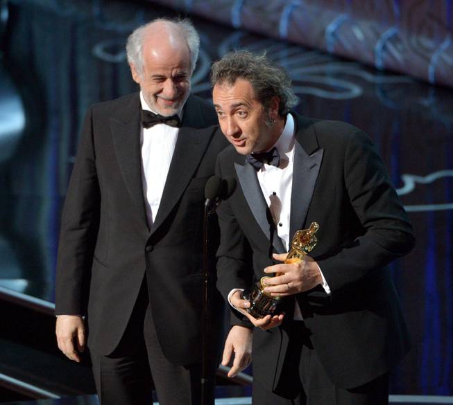 Toni Servillo, left, and Paolo Sorrentino accept the award for best foreign language film of the year for &quot;The Great Beauty&quot; during the Oscars at the Dolby Theatre on Sunday, March 2, 2014, in Los Angeles.  (Photo by John Shearer/Invision/AP)