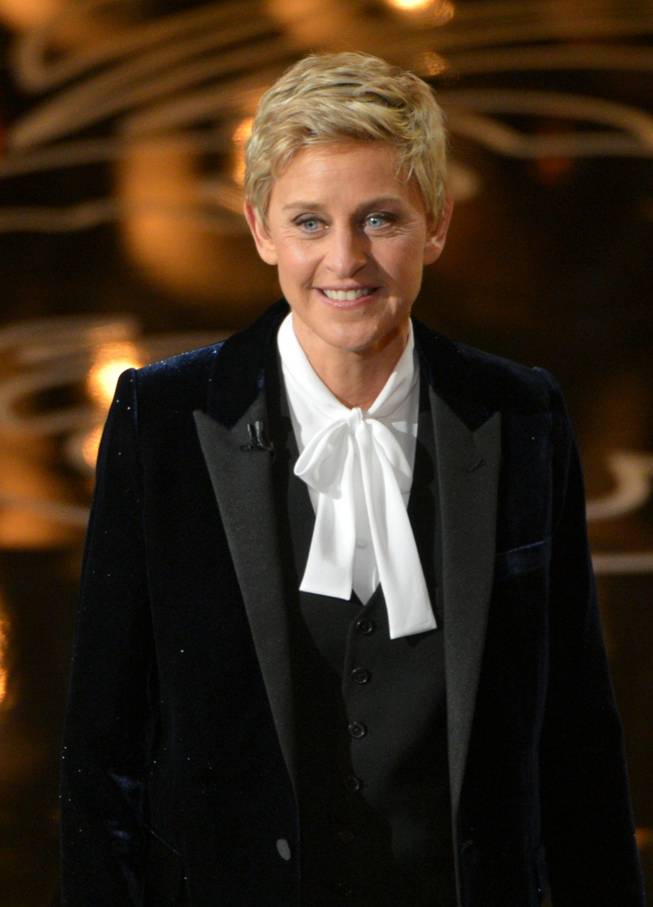 Host Ellen DeGeneres speaks on stage during the Oscars at the Dolby Theatre on Sunday, March 2, 2014, in Los Angeles.  (Photo by John Shearer/Invision/AP)