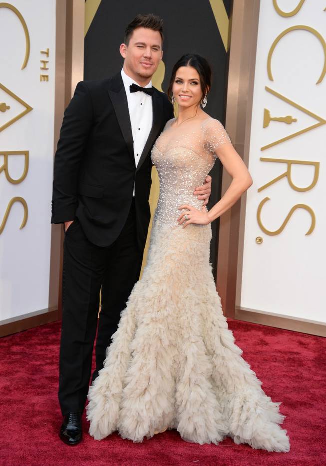Channing Tatum and Jenna Dewan Tatum arrive at the Oscars on Sunday, March 2, 2014, at the Dolby Theater in Los Angeles.
