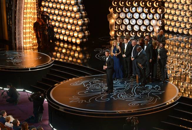 Brad Pitt and the cast and crew of "12 Years a Slave" accept the award for the best picture of the year during the Oscars at the Dolby Theatre on Sunday, March 2, 2014, in Los Angeles.