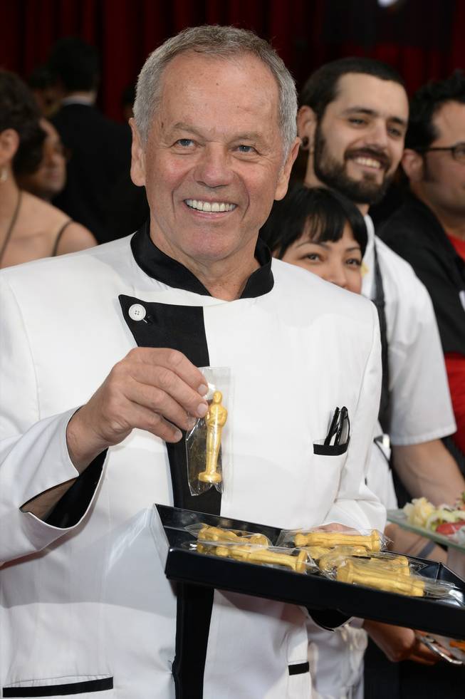 Wolfgang Puck arrives at the Oscars on Sunday, March 2, 2014, at the Dolby Theatre in Los Angeles.  (Photo by Dan Steinberg/Invision/AP)