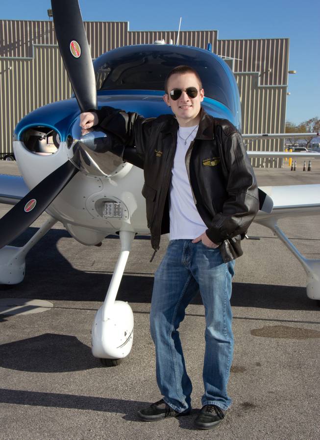 Jordan Livingston poses with a Cessna airplane. Livingston, who is deaf, just received a scholarship to become a pilot.