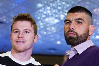 Light middleweight boxers Canelo Alvarez, left, and Alfredo Angulo, both of Mexico, pose in the lobby of the MGM Grand during arrivals Tuesday, March 4, 2014. The fighters will meet for a non-title, 12-round fight at the MGM Grand Garden Arena on Saturday.
