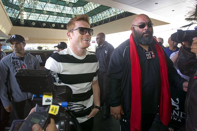 Light middleweight boxer Canelo Alvarez, center, of Mexico, arrives at the MGM Grand Tuesday, March 4, 2014. Alvarez will face Alfredo Angulo, also of Mexico, in a non-title, 12-round fight at the MGM Grand Garden Arena on Saturday.