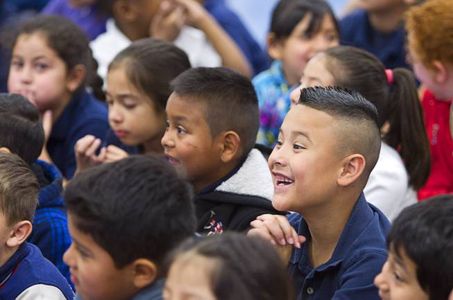 Student react to comedy-magician Mac King as he kicks off his Magical Literacy Tour: Nevada Reading Week 2014 with students at Vegas Verdes Elementary School Tuesday, March 4, 2014. For the fourth year, the Harrahs headliner will visit schools to perform magic tricks, talk about the importance of reading and distribute books collected during book drives.