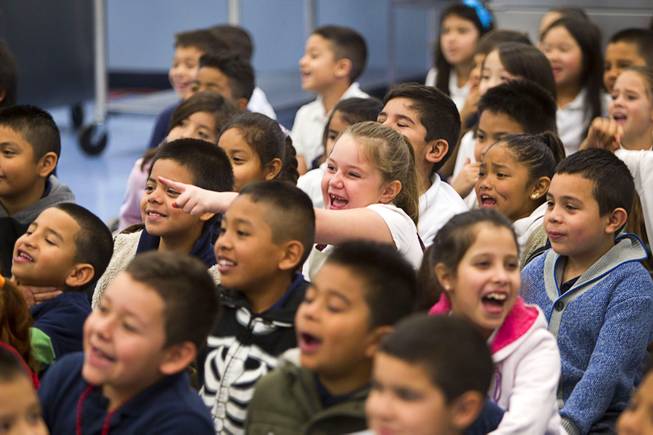 Students react to comedy-magician as Mac King appears to eat an earthworm during his Magical Literacy Tour: Nevada Reading Week 2014 with students at Vegas Verdes Elementary School Tuesday, March 4, 2014. For the fourth year, the Harrahs headliner will visit schools to perform magic tricks, talk about the importance of reading and distribute books collected during book drives.