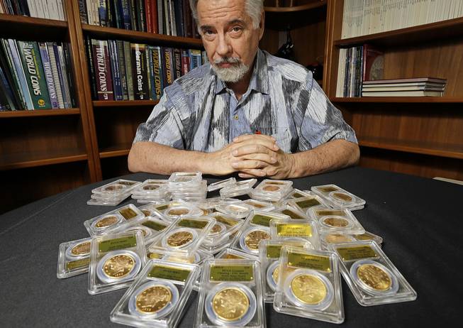 David Hall, co-founder of Professional Coin Grading Service, with some of the 1,427 Gold Rush-era U.S. gold coins at his office in Santa Ana, Calif., on Tuesday, Feb. 25, 2014. 