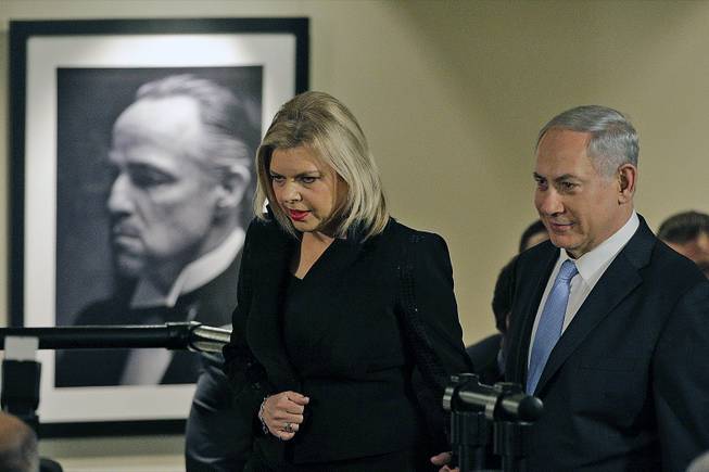 Israeli Prime Minister Benjamin Netanyahu, right, and his wife, Sara, arrive for the screening of the television documentary "Israel: The Royal Tour" at Paramount Studios on Tuesday, March 4, 2014, in Los Angeles. 