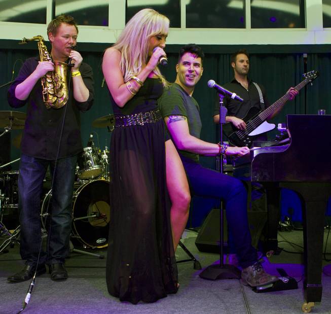 Lorena Peril is accompanied by Frankie Moreno during Las Vegas Weekly's Unscripted Party featuring Stifler in the Havana Room on Tuesday, March 4, 2014, at the Tropicana.