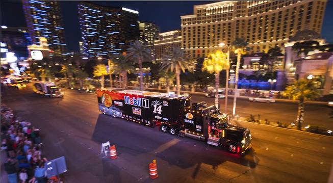 Driver Tony Stewart's NASCAR Hauler is one of many moving up the Las Vegas Strip in celebration for the upcoming Kobalt 400 on Wednesday, March 05, 2014.