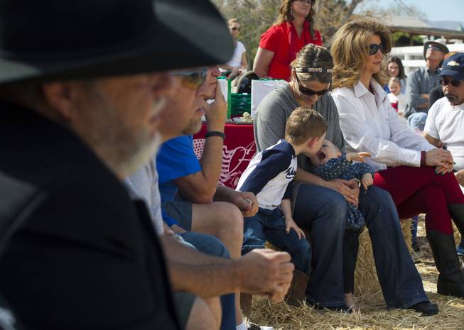 Attendees listen to speakers during a Horses4Heroes ribbon-cutting ceremony and grand-opening event at Tule Springs on Thursday, March 06, 2014.