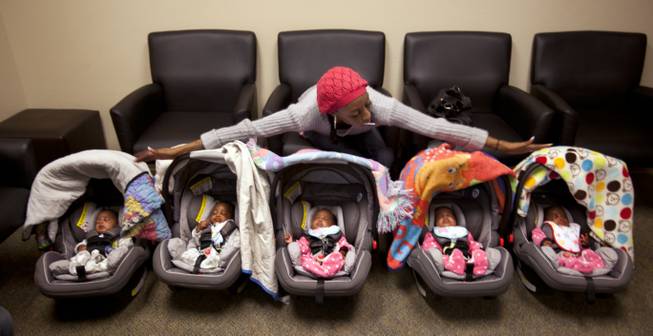 Evonne Derrico shows off her quintuplets as they await their eye doctor appointments. “You’ve won 18 years of responsibility,” she jokes to her husband. “Two boys and three girls.”