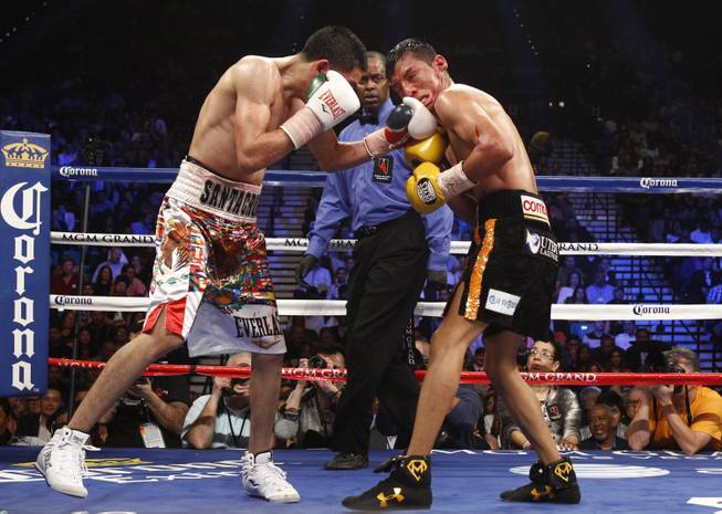 WBC super bantamweight champion Leo Santa Cruz, left, connects on Cristian Mijares, both of Mexico, during their title fight at the MGM Grand Garden Arena on Saturday, March 8, 2014.
