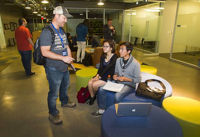 Matt Wong, left, a member of the Zappos audio/visual team, talks with Lily Norman, and Ulysses Batalona of Clark High School during a workshop for first annual Congressional Science, Technology, Engineering and Math (STEM) Academic Competition, also known as the House App Contest, at Zappos in downtown Las Vegas Monday, March 10, 2014. The national contest for high school students, established by members of the U.S. House of Representatives in 2013, involves developing an app and creating a video demonstration to explain it.