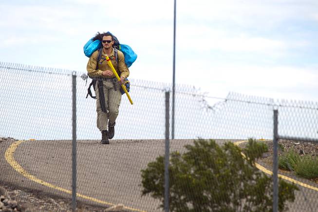 Robert Sorensen, 27, heads out for a walk from Henderson to Israel Monday, March 10, 2014. Sorensen said he is not a religious man but that it was a "spiritual" journey. Sorensen estimated the trip to be 16,500 miles.