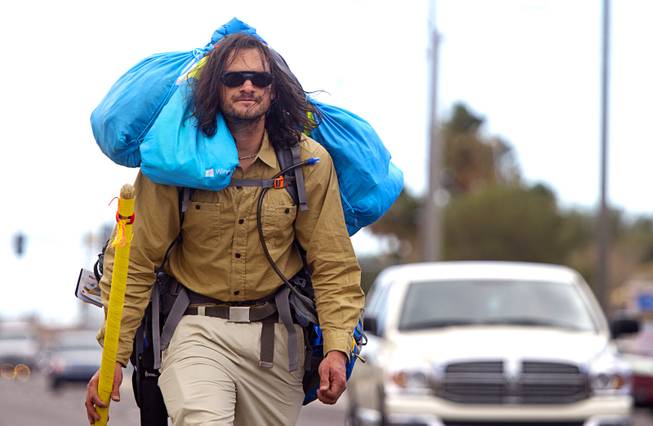 Robert Sorensen, 27, heads north on Pecos Road as he sets off on a walk from Henderson to Israel Monday, March 10, 2014. Sorensen said he is not a religious man but that it was a "spiritual" journey. Sorensen estimated the trip to be 16,500 miles.
