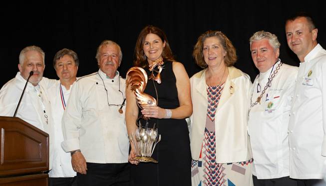 Elizabeth Blau, center, with her Woman of the Year award.
