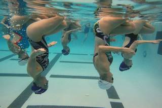 The Nevada Desert Mermaid synchronized swim team practices Tuesday, March 11, 2014.