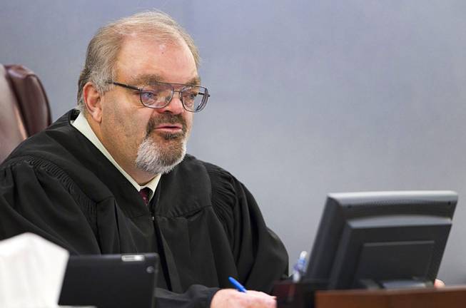 Judge Conrad Hafen speaks to attorneys during Christine Allen's court appearance at the Regional Justice Center Wednesday, March 12, 2014. Allen told police that she drowned her 3-year-old son because of voices in her head, according to a Metro Police arrest report.
