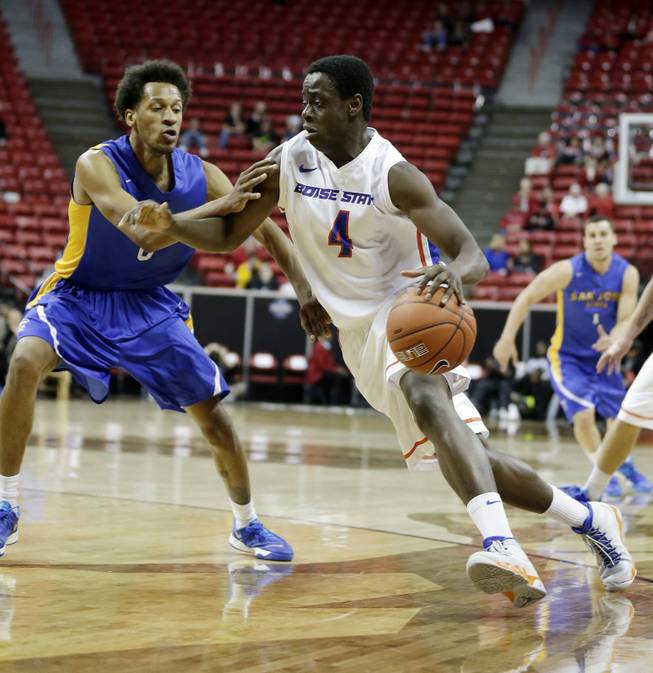 Boise State's Thomas Bropleh drives past San Jose State's Ryan Watkins during the second half of a Mountain West Conference men's tournament NCAA college basketball game Wednesday, March 12, 2014, in Las Vegas. Boise State defeated San Jose State 83-52. (AP Photo/Isaac Brekken)