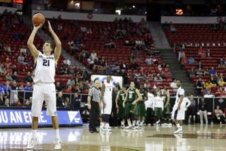 Utah State's Spencer Butterfield shoots a free throw after a technical foul on Daniel Bejarano during the second half of a Mountain West Conference tournament NCAA college basketball game Wednesday, March 12, 2014, in Las Vegas. Utah State defeated Colorado State 73-69. (AP Photo/Isaac Brekken)