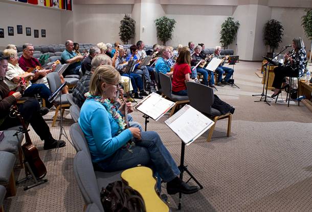 Founder Lynn Weaver, right, leads a meeting of the Las Vegas Ukulele Club at the Las Vegas Church of the Nazarene Thursday, March 13, 2014. The club meets every Thursday.