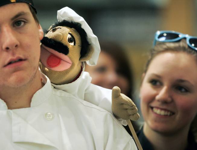 Student William Buchberger has Francois the puppet on his shoulder during the Culinary Collision at the Whole Foods Market in Town Square on Thursday, March 13, 2014.