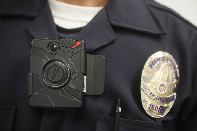 A Los Angeles Police officer is shown with an on-body camera during a demonstration for media in Los Angeles, Jan. 15, 2014. Thousands of police agencies have equipped officers with cameras on their uniforms, but they’ve frequently lagged in setting policies on how they’re used. 