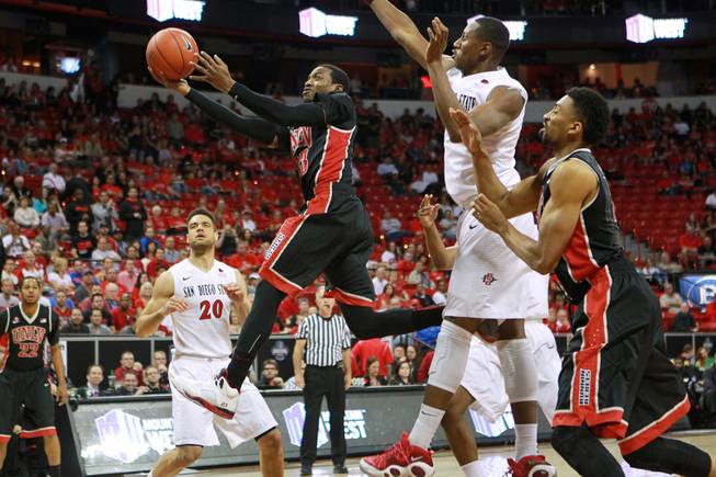 UNLV guard Deville Smith drives to the basket against San Diego State during the first half of their Mountain West Conference semifinal game Friday, March 14, 2014 at the Thomas & Mack Center.