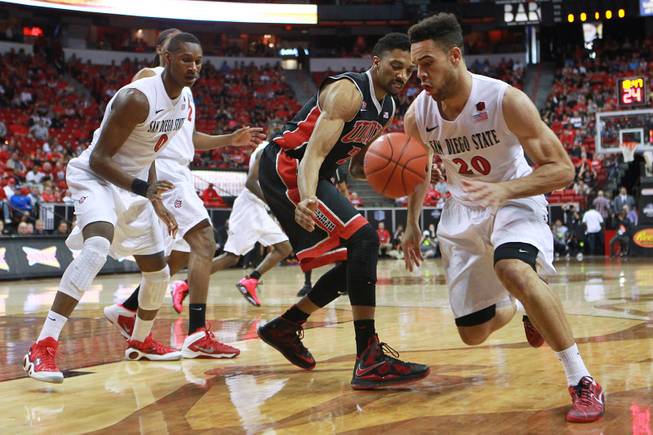 San Diego State forward J.J. O'Brien steals the ball from UNLV forward Khem Birch during the first half of their Mountain West Conference semifinal game Friday, March 14, 2014 at the Thomas & Mack Center.