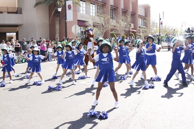 The cheer club from Rose Warren Elementary school perform to Beyonce's "Move Your Body" during the annual St. Patrick's Day parade in Henderson Saturday, March 15, 2014.
