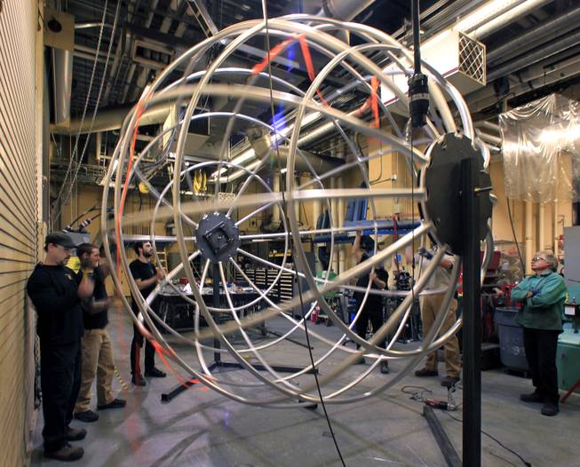 Fabricators with “One Night for One Drop” prepare their completed Earth Globe for transport while continuing work of the bedroom set props Thursday, March 13, 2014, for the upcoming show at Michael Jackson One Theater at Mandalay Bay. The one-night-only performance is March 21.