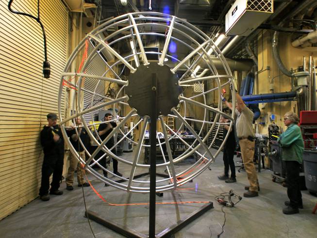 Fabricators with “One Night for One Drop” prepare their completed Earth Globe for transport to the Michael Jackson One Theater at Mandalay Bay on Thursday, March 13, 2014.