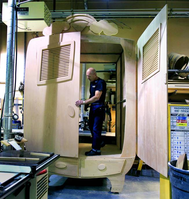 Structural fabricator Richard Anderson with “One Night for One Drop” continues his work on a bulging, oversized wardrobe Tuesday, March 11, 2014, as part of a bedroom set for the March 21 benefit show.