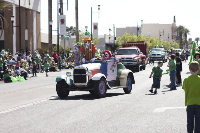 The Zelzah Shrine Clowns greet the crowd during the annual St. Patrick's Day parade in Henderson Saturday, March 15, 2014.